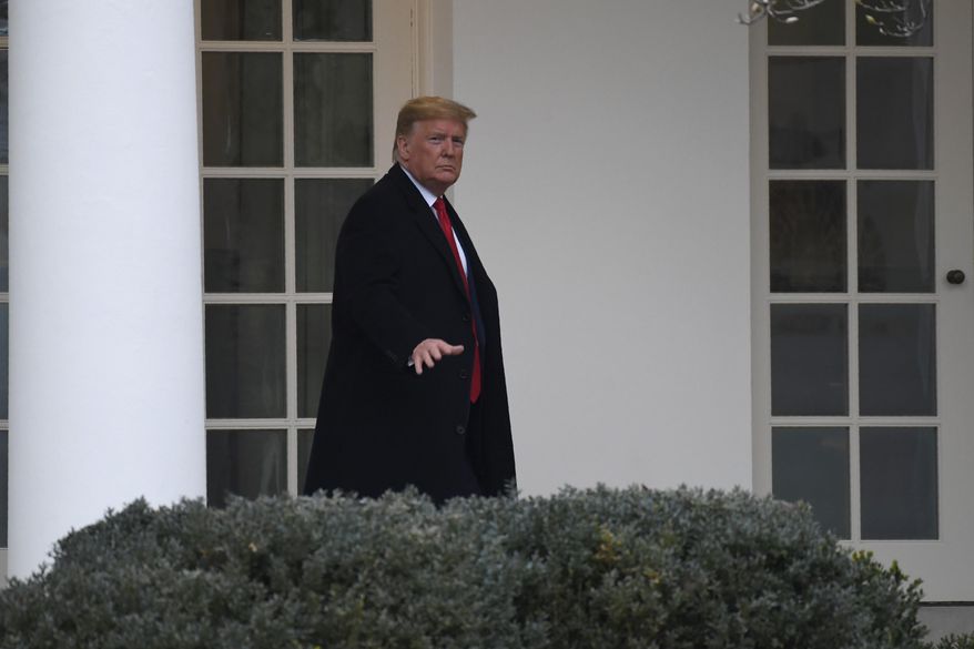 President Donald Trump walks along the colonnade of the White House in Washington, Monday, Jan. 13, 2020. A U.S. cybersecurity company says Russian military agents successfully hacked the Ukrainian gas company at the center of the scandal that led to President Donald Trump&#x27;s impeachment. (AP Photo/Susan Walsh)