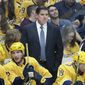 In this Oct. 8, 2019, file photo, Nashville Predators head coach Peter Laviolette watches the action in an NHL hockey game against the San Jose Sharks, in Nashville, Tenn. (AP Photo/Mark Humphrey, File)