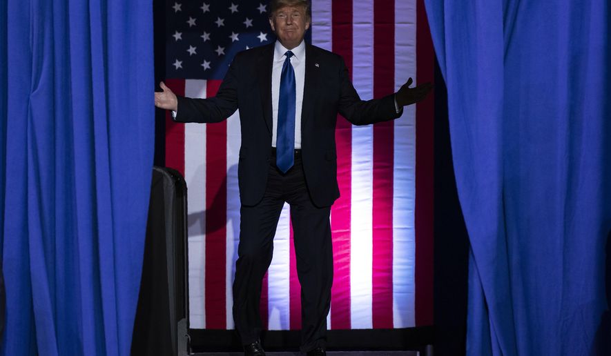 President Donald Trump arrives at UW-Milwaukee Panther Arena to speak at a campaign rally, Tuesday, Jan. 14, 2020, in Milwaukee. (AP Photo/ Evan Vucci)
