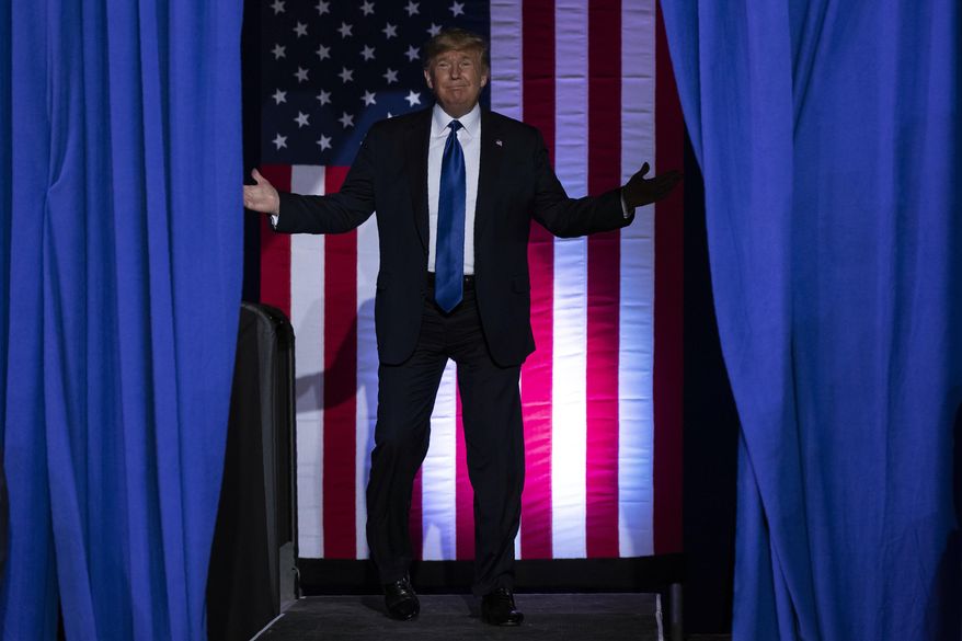 President Donald Trump arrives at UW-Milwaukee Panther Arena to speak at a campaign rally, Tuesday, Jan. 14, 2020, in Milwaukee. (AP Photo/ Evan Vucci)