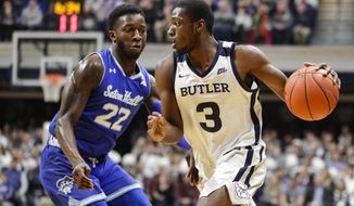 Butler guard Kamar Baldwin (3) drives on Seton Hall guard Myles Cale (22) in the first half of an NCAA college basketball game in Indianapolis, Wednesday, Jan. 15, 2020. (AP Photo/Michael Conroy)