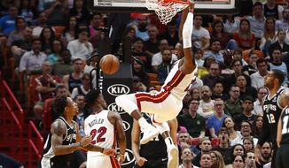 Miami Heat center Bam Adebayo (13) dunks the ball against the San Antonio Spurs in the first half of an NBA basketball game Wednesday, Jan. 15, 2020, in Miami. (AP Photo/Brynn Anderson)
