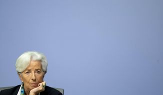President of European Central Bank Christine Lagarde listens during a press conference after a meeting of the governing council in Frankfurt, Germany, Thursday, Dec. 12, 2019. (AP Photo/Michael Probst)