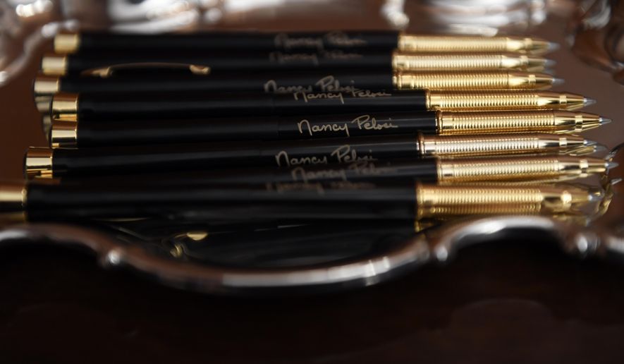 The pens that House Speaker Nancy Pelosi of Calif., will use to sign the resolution to transmit the two articles of impeachment against President Donald Trump to the Senate for trial on Capitol Hill in Washington, Wednesday, Jan. 15, 2020. . (AP Photo/Susan Walsh)