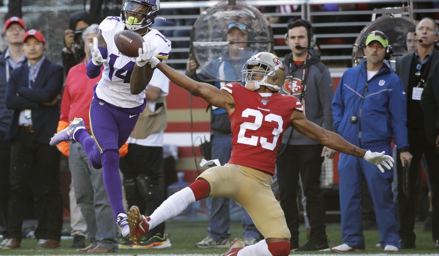 Minnesota Vikings wide receiver Stefon Diggs (14) catches a touchdown pass in front of San Francisco 49ers cornerback Ahkello Witherspoon (23) during the first half of an NFL divisional playoff football game, Saturday, Jan. 11, 2020, in Santa Clara, Calif. (AP Photo/Marcio Jose Sanchez)