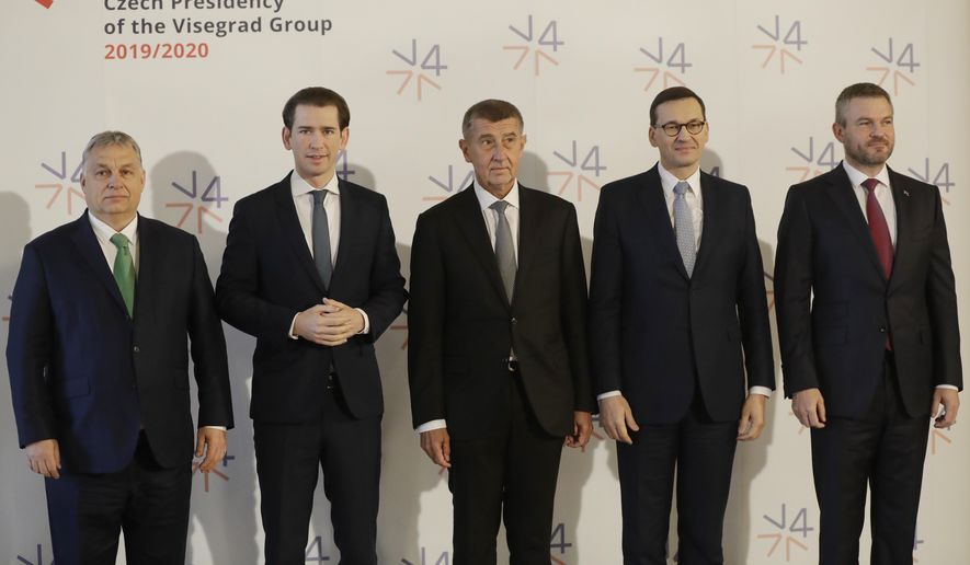 Prime Ministers of Slovakia Peter Pellegrini, right, Poland Mateusz Morawiecki, 2nd right, Czech Republic Andrej Babis, center, Hungary Viktor Orban, left, and Austria's Chancellor Sebastian Kurz, 2nd left, pose for a photo as they meet at the National Museum in Prague, Czech Republic, Thursday, Jan. 16, 2020. (AP Photo/Petr David Josek)