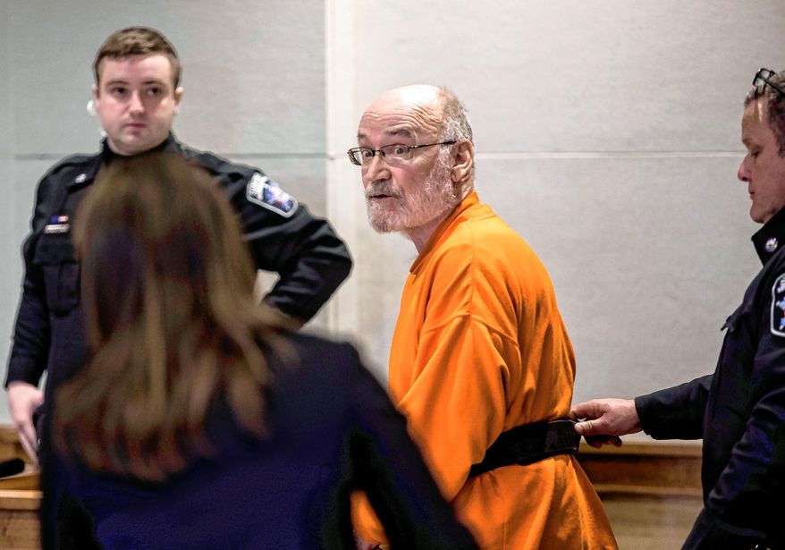 In this Friday, April 5, 2019 photo, former St. Paul's student Ben Baker confers with his lawyer after his arraignment and bail hearing at Merrimack Superior Court in Concord, N.H. A mistrial was declared in the case of Baker, who had been accused of sexually assaulting two children on the campus of St. Paul's school in New Hampshire in the 1970s. Baker, of Falls Church, Virginia, was arrested in February 2019 and charged with being a fugitive after Concord police issued a warrant charging him with a dozen sex crimes, including aggravated sexual assault. (Geoff Forester/The Concord Monitor via AP)
