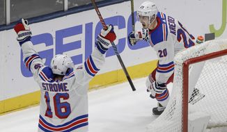New York Rangers&#x27; Chris Kreider (20) celebrates with teammate Ryan Strome (16) after scoring the game winning goal during the third period of an NHL hockey game against the New York Islanders Thursday, Jan. 16, 2020, in Uniondale, N.Y. The Rangers won 3-2. (AP Photo/Frank Franklin II)