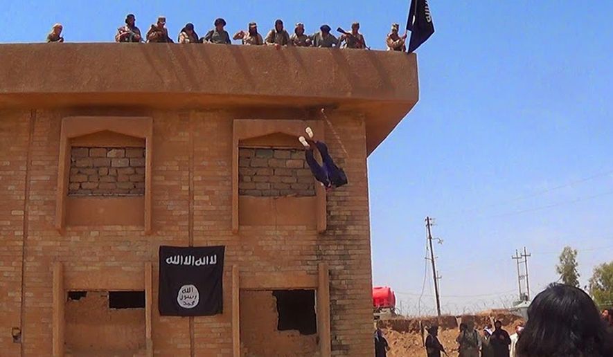 In this photo released on January 14, 2015, by a militant website, which has been verified and is consistent with other AP reporting, Islamic State militants kill a man they accused of being a homosexual by throwing him off a building in Syria&#39;s northeastern province of Hassakeh.   The Washington-based Syria Justice and Accountability Center, a U.S.-based Syrian rights group, said Thursday, Jan. 16, 2020,  that evidence, documents produced by the Islamic State militants themselves,  could help identify individuals responsible for atrocities during the militants four-year reign of terror in Syria, thus enabling prosecution for international crimes.  (Militant website via AP)