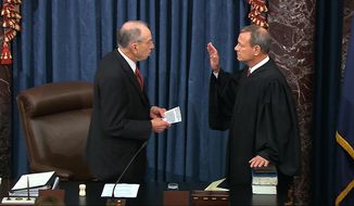 In this image from video, President Pro Tempore of the Senate Sen. Chuck Grassley, R-Iowa., swears in Supreme Court Chief Justice John Roberts as the presiding officer for the impeachment trial of President Donald Trump in the Senate at the U.S. Capitol in Washington, Thursday, Jan. 16, 2020. (Senate Television via AP)