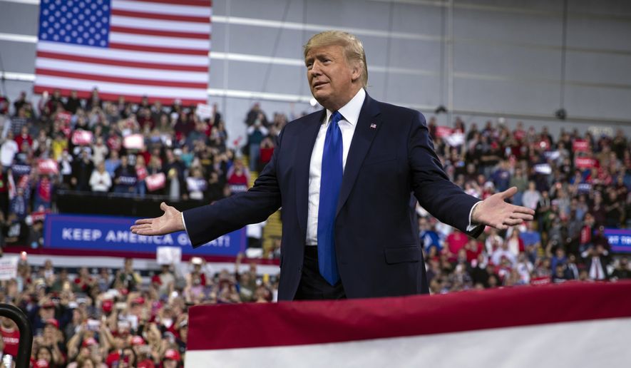 In this Jan. 14, 2020, photo, President Donald Trump arrives at UW-Milwaukee Panther Arena to speak at a campaign rally in Milwaukee. Trump&#39;s surrogates are fanning out across the country as part of an aggressive effort to stretch his appeal beyond the base of working-class white voters who propelled him to victory in 2016 (AP Photo/ Evan Vucci)