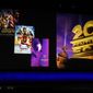 FILE - In this April 3, 2019, file photo, Alan Horn, chairman of The Walt Disney Studios, speaks underneath poster images for 20th Century Fox films during the Walt Disney Studios Motion Pictures presentation at CinemaCon 2019, the official convention of the National Association of Theatre Owners (NATO) at Caesars Palace in Las Vegas. Disney is dropping the word “Fox” from the movie studios it acquired as part of last year&#39;s $71 billion purchase of Fox&#39;s entertainment business, according to published reports. According to trade publication Variety, 20th Century Fox will become 20th Century Studios, while Fox Searchlight Pictures will be Searchlight Pictures. Disney will still run them as separate studios within the company. (Photo by Chris Pizzello/Invision/AP, File)