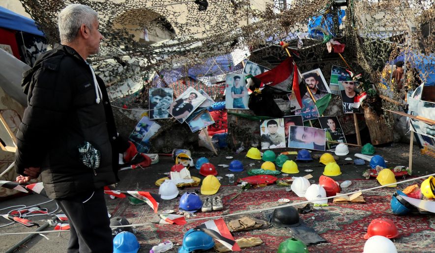 Posters of protesters who have been killed in anti-government demonstrations and their belongings are displayed in Tahrir Square, in Baghdad, Iraq, Friday, Jan. 17, 2020. (AP Photo/Hadi Mizban)