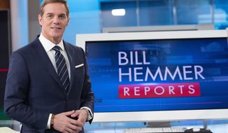 FOX News Channel&#39;s Bill Hemmer, anchor of news program Bill Hemmer Reports, poses for a photo on the set of his new show, Friday, Jan. 17, 2020, in New York. Hemmer takes over the 3 p.m. ET news hour that Shepard Smith vacated when he abruptly quit the network late last year. (AP Photo/Mary Altaffer)