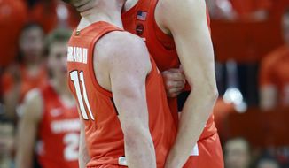 Syracuse guard Buddy Boeheim (35) celebrates a there point play with teammate Syracuse guard Joseph Girard III (11) during the second half of an NCAA college basketball game in Charlottesville, Va., Saturday, Jan. 11, 2020. Syracuse defeated Virginia 63-55 in overtime. (AP Photo/Steve Helber)