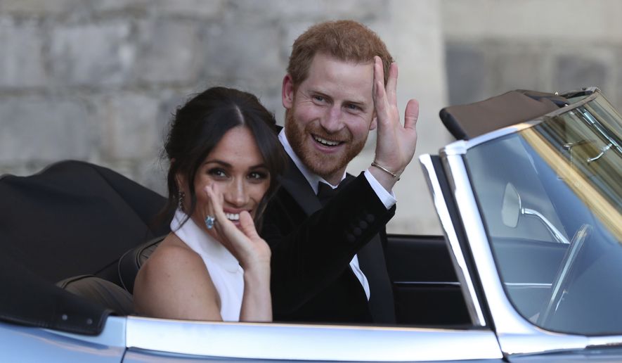 Meghan Markle and Prince Harry, leave Windsor Castle in a convertible car after their wedding in Windsor, England, to attend an evening reception at Frogmore House. (Steve Parsons/pool photo via AP, File)