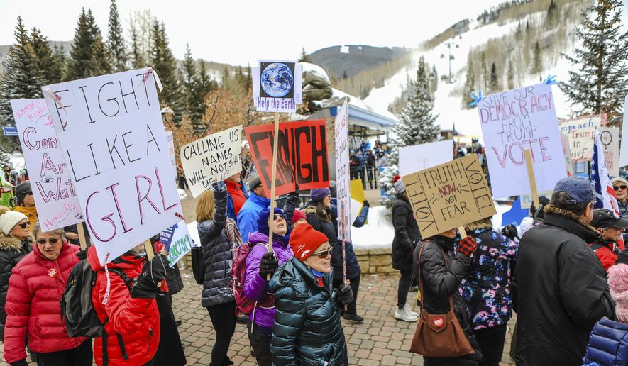People participate in the Women&#39;s March in Vail, Colo., Saturday, Jan. 18, 2020. Thousands gathered in cities across the country Saturday as part of the nationwide Women&#39;s March rallies focused on issues such as climate change, pay equity, reproductive rights and immigration. (Chris Dillmann/Vail Daily via AP)