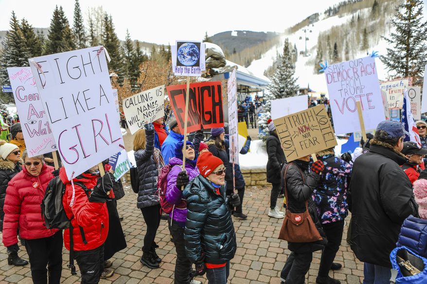 People participate in the Women's March in Vail, Colo., Saturday, Jan. 18, 2020. Thousands gathered in cities across the country Saturday as part of the nationwide Women's March rallies focused on issues such as climate change, pay equity, reproductive rights and immigration. (Chris Dillmann/Vail Daily via AP)