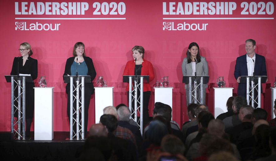 From left, Labour Members of Parliament, Rebecca Long-Bailey, Jess Phillips, Emily Thornberry, Lisa Nandy and Keir Starmer stand on the stage, during the first Labour leadership hustings at the ACC Liverpool, in Liverpool, England, Saturday, Jan. 18, 2020. (Danny Lawson/PA via AP)