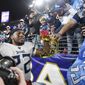 In this Saturday, Jan. 11, 2020 photo, Tennessee Titans running back Derrick Henry (22) gets a crown from fan Mohammed Khan after the team&#39;s 28-12 win over the Baltimore Ravens in an NFL Divisional Playoff game at M&amp;amp;T Bank Stadium in Baltimore, Md. (Ricky Rogers/The Tennessean via AP)