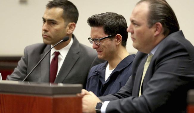 FILE - In this April 12, 2016, file photo, Steven Jones, middle, weeps as Coconino County Superior Court Judge Dan Slayton announces his decision to amend the conditions of release for Jones in Flagstaff, Ariz. The former Northern Arizona University student is in jail awaiting his upcoming sentencing in a 2015 shooting that killed a student and three others were wounded. Before pleading guilty on Jan. 9, 2020, Jones was scheduled to face a second murder trial this month after a jury deadlocked on charges in his first trial. (Jake Bacon/Arizona Daily Sun via AP, File)