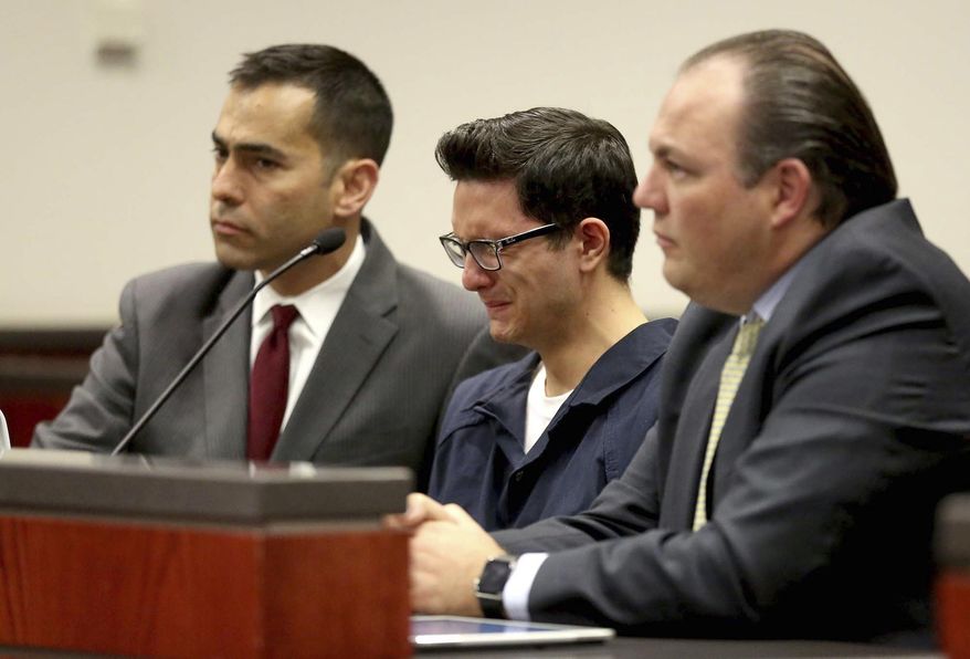 FILE - In this April 12, 2016, file photo, Steven Jones, middle, weeps as Coconino County Superior Court Judge Dan Slayton announces his decision to amend the conditions of release for Jones in Flagstaff, Ariz. The former Northern Arizona University student is in jail awaiting his upcoming sentencing in a 2015 shooting that killed a student and three others were wounded. Before pleading guilty on Jan. 9, 2020, Jones was scheduled to face a second murder trial this month after a jury deadlocked on charges in his first trial. (Jake Bacon/Arizona Daily Sun via AP, File)