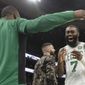 Boston Celtics guard Jaylen Brown (7) celebrates with teammate Kemba Walker in the second half of an NBA basketball game against the Detroit Pistons, Friday, Dec. 20, 2019, in Boston. (AP Photo/Elise Amendola)