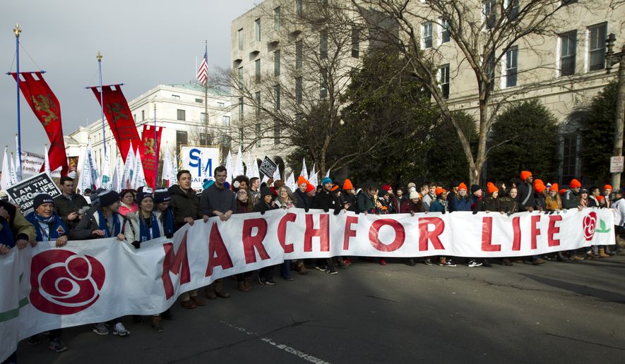 Pro-life activists march outside of the U.S. Supreme Court, during the March for Life in Washington Friday, Jan. 18, 2019. (AP Photo/Jose Luis Magana) ** FILE **