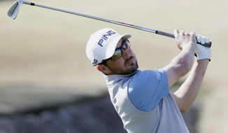 Andrew Landry follows through on the fourth tee during the final round of The American Express golf tournament on the Stadium Course at PGA West in La Quinta, Calif., Sunday, Jan. 19, 2020. (AP Photo/Alex Gallardo)