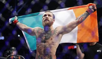 Conor McGregor celebrates after defeating Donald &amp;quot;Cowboy&amp;quot; Cerrone during a UFC 246 welterweight mixed martial arts bout Saturday, Jan. 18, 2020, in Las Vegas. (AP Photo/John Locher)