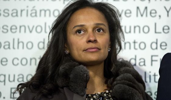 In this March 5, 2015 photo, Isabel dos Santos, reputedly Africa&#39;s richest woman, attends the opening of an art exhibition featuring works from the collection of her husband and art collector Sindika Dokolo in Porto, Portugal. On Monday, Jan. 6, 2020, Angola&#39;s foreign minister Manuel Augusto said that there is no political motivation behind the government&#39;s demand for more than $1 billion from dos Santos, her husband and a Portuguese business partner. Isabel dos Santos is a daughter of Jose Eduardo dos Santos, who ruled the oil- and diamond-rich nation for 38 years until 2017. (AP Photo/Paulo Duarte)