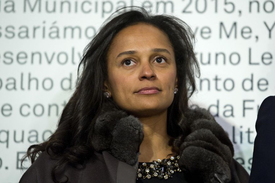 In this March 5, 2015 photo, Isabel dos Santos, reputedly Africa&#39;s richest woman, attends the opening of an art exhibition featuring works from the collection of her husband and art collector Sindika Dokolo in Porto, Portugal. On Monday, Jan. 6, 2020, Angola&#39;s foreign minister Manuel Augusto said that there is no political motivation behind the government&#39;s demand for more than $1 billion from dos Santos, her husband and a Portuguese business partner. Isabel dos Santos is a daughter of Jose Eduardo dos Santos, who ruled the oil- and diamond-rich nation for 38 years until 2017. (AP Photo/Paulo Duarte)