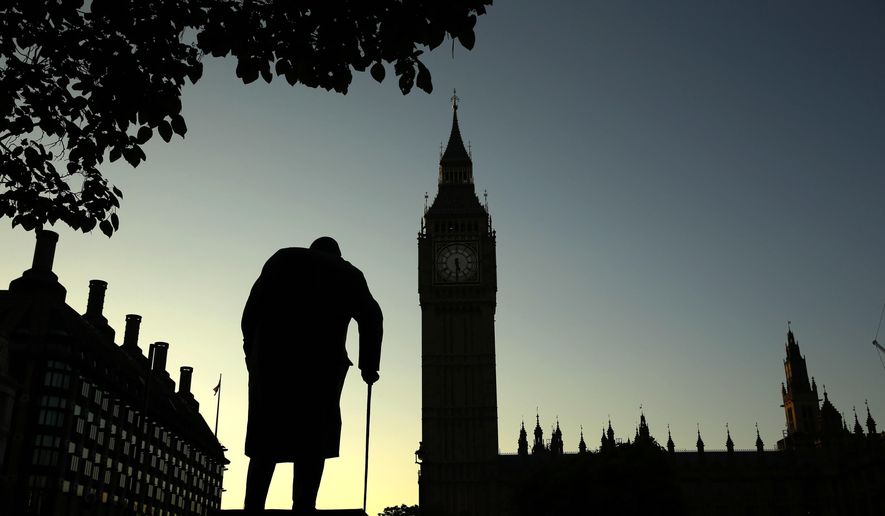 In this Friday, June 24, 2016, file photo a statue of Winston Churchill is silhouetted against the Houses of Parliament and the early morning sky in London, Friday, June 24, 2016. A day earlier, Britain had voted to leave the European Union in a referendum. On Jan. 31, 2020, Britain is scheduled to leave the EU after 47 years of membership. (AP Photo/Matt Dunham, File)