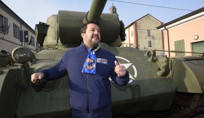 League&#x27;s leader Matteo Salvini poses next to a tank that was used in an old fiction movie during an electoral rally, in Brescello, central Italy, Sunday, Jan. 12, 2020. (Stefano Cavicchi/LaPresse via AP)