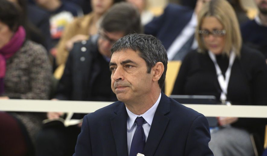 Former Catalan regional police chief Josep Lluis Trapero sits in the dock of the National court on the outskirts of Madrid, Spain, Monday Jan. 20, 2020. A trial starts Monday against former Catalan regional police chief Josep Lluis Trapero and other officials for their role in the 2017 independence attempt. (Fernando Villar, Pool photo via AP)