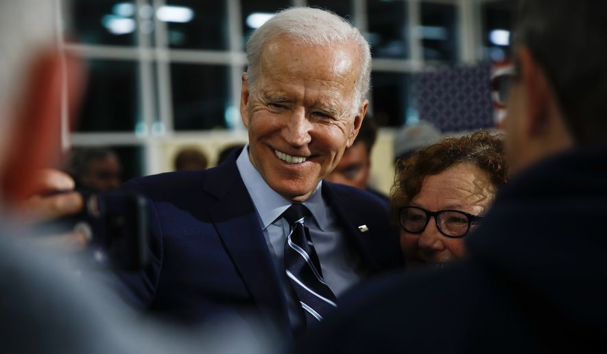 Democratic presidential candidate former Vice President Joe Biden takes a selfie with an attendee during a campaign event at Iowa Central Community College, Tuesday, Jan. 21, 2020, in Fort Dodge, Iowa. (AP Photo/Matt Rourke)