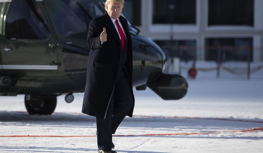 US President Donald Trump gestures as he arrives in Davos, Switzerland on Marine One, Tuesday, Jan. 21, 2020. President Trump arrived in Switzerland on Tuesday to start a two-day visit to the World Economic Forum. (AP Photo/Evan Vucci)