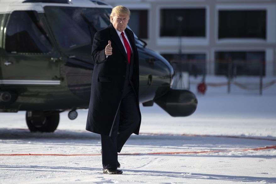 US President Donald Trump gestures as he arrives in Davos, Switzerland on Marine One, Tuesday, Jan. 21, 2020. President Trump arrived in Switzerland on Tuesday to start a two-day visit to the World Economic Forum. (AP Photo/Evan Vucci)
