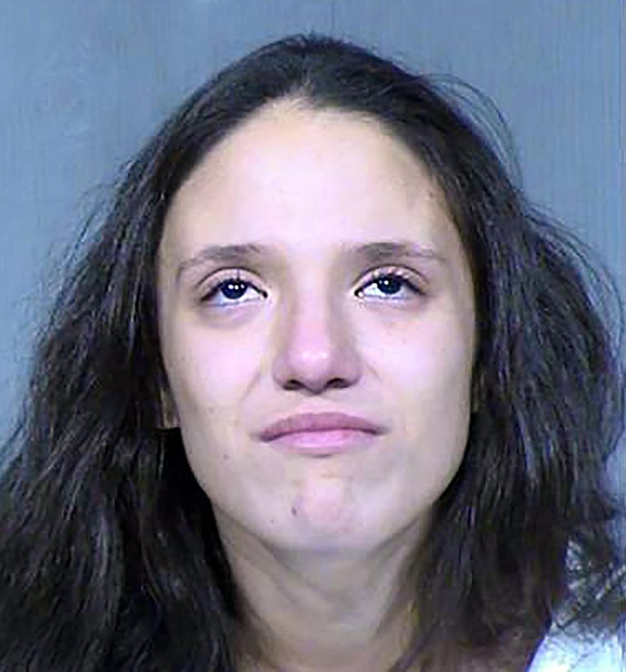 This Tuesday, Jan. 21, 2020 booking photo released by the Maricopa County Sheriff&#39;s Office, shows Rachel Henry, 22, who has been arrested on suspicion of killing her three children. They were found dead inside the family&#39;s home after firefighters got a call about a drowning authorities said Tuesday. (Maricopa County Sheriff&#39;s Office via AP)
