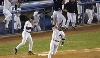 FIEE - In this Oct. 31, 2001, file photo, New York Yankees&#x27; Derek Jeter celebrates his game-winning home run in the 10th inning as he rounds first base in Game 4 of baseball&#x27;s World Series against the Arizona Diamondbacks at Yankee Stadium in New York. Jeter could be a unanimous pick when Baseball Hall of Fame voting is announced Tuesday, Jan. 21, 2020. (AP Photo/Bill Kostroun, File)