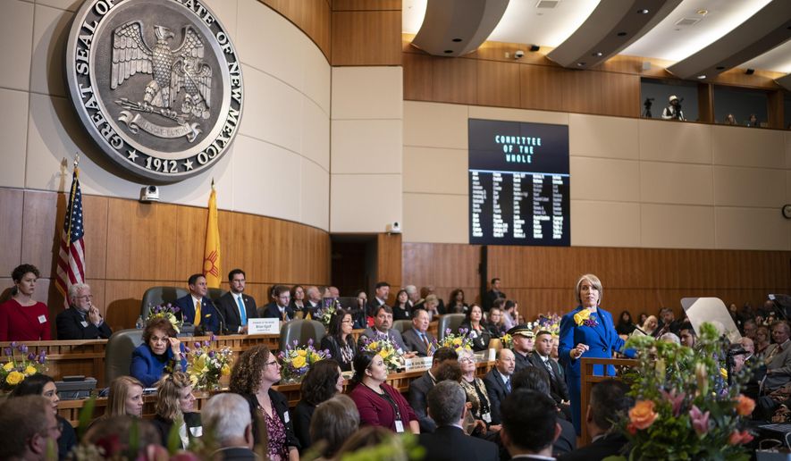 New Mexico Gov. Michelle Lujan Grisham gives her State of the State address during the opening of the New Mexico legislative session in the House chambers at the state Capitol in Santa Fe, N.M. on Tuesday, Jan. 21, 2020. (AP Photo/Craig Fritz)