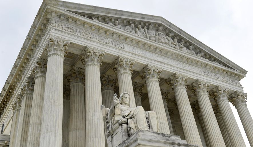 FILE - This Oct. 3, 2014 file photo shows the U.S. Supreme Court in Washington. The Supreme Court has declined to take a case stemming from the 2014 water crisis in Flint, Michigan. (AP Photo/Susan Walsh)