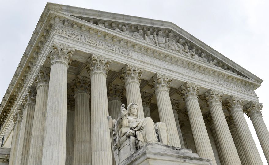 FILE - This Oct. 3, 2014 file photo shows the U.S. Supreme Court in Washington. The Supreme Court has declined to take a case stemming from the 2014 water crisis in Flint, Michigan. (AP Photo/Susan Walsh)