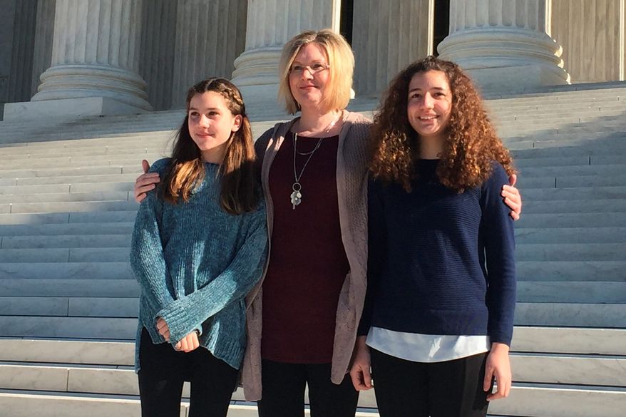 Kendra Espinoza, with daughters Naomi and Sarah, is the lead plaintiff in a Supreme Court case against Montana officials for discrimination because of the plaintiffs' faith by prohibiting taxpayer-funded scholarships to be used at a Christian school. (ASSOCIATED PRESS)