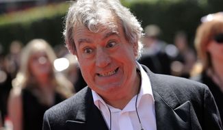 FILE - In this Saturday, Aug. 21, 2010 file photo, Terry Jones arrives at the Creative Arts Emmy Awards in Los Angeles. Terry Jones, a member of the Monty Python comedy troupe, has died at 77. Jones&#39;s agent says he died Tuesday Jan. 21, 2020. In a statement, his family said he died “after a long, extremely brave but always good humored battle with a rare form of dementia, FTD.” (AP Photo/Chris Pizzello, file)