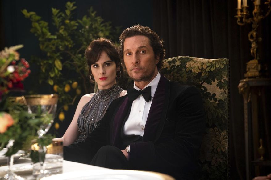 This image released by STXfilms shows Michelle Dockery, left, and Matthew McConaughey in a scene from "The Gentlemen." (Christopher Raphael/STXfilms via AP) ** FILE **