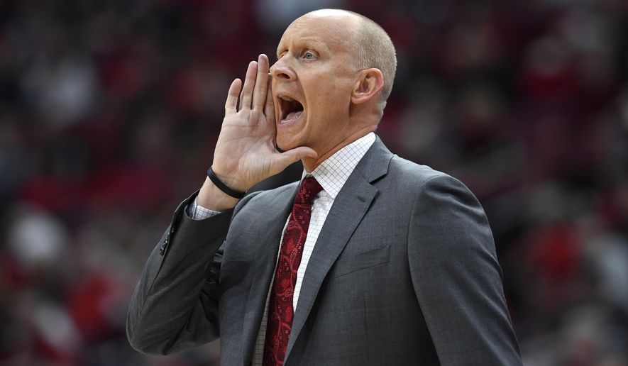 Louisville head coach Chris Mack shouts instructions to his team during the first half of an NCAA college basketball game in Louisville, Ky., Wednesday, Jan. 22, 2020. (AP Photo/Timothy D. Easley)