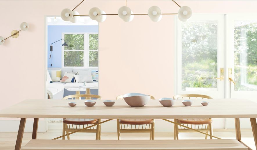 This photo provided by Benjamin Moore shows a room with Benjamin Moor'es 2020 Color of the Year called First Light, a dreamy, soft shade of pink. Director of Color Marketing & Development Andrea Magno says that while the color was already part of the 3500-hue library, "it's always fortuitous when the trend concept and color name complement one another. While descriptions like 'light pink' are quite straightforward, we also look for names that evoke positive associations and experiences." (Benjamin Moore via AP)