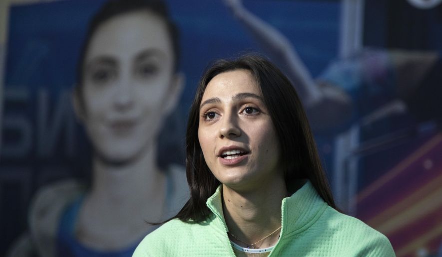 Russia&#x27;s high jump world champion Mariya Lasitskene speaks during an interview with the Associated Press in Moscow, Russia, Wednesday, Jan. 22, 2020. The Olympics are six months away, but Russia&#x27;s top track and field athlete has no idea if she&#x27;ll be there. (AP Photo/Pavel Golovkin)