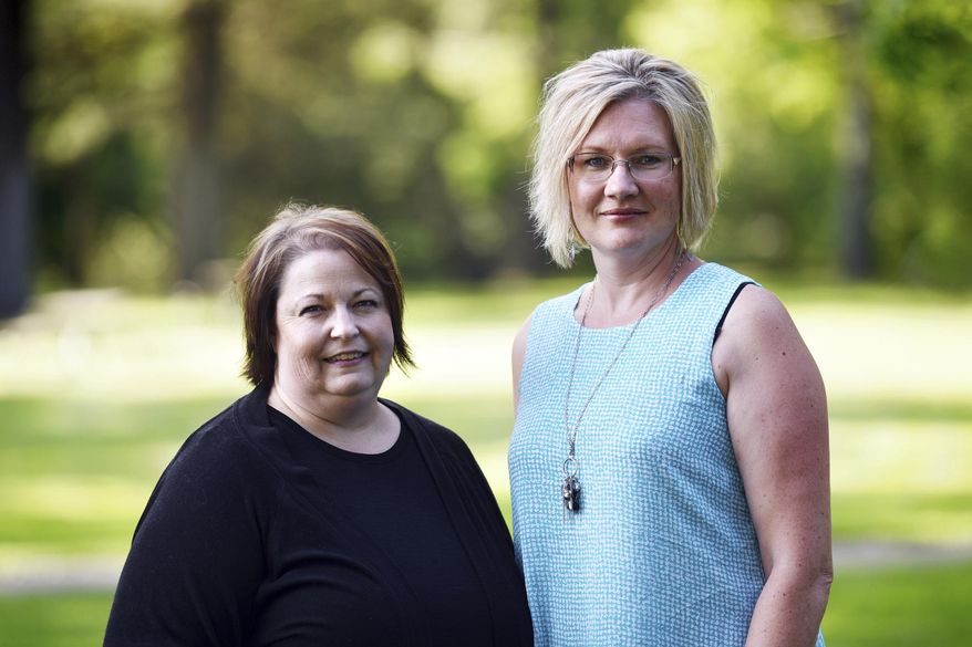 This July 31, 2019 photo shows Stillwater Christian School parents Jeri Anderson and Kendra Espinoza at Woodland Park in Kalispell, Mont.  The Supreme Court will hear arguments Wednesday, Jan. 22, 2020 in a dispute over a Montana scholarship program for private K-12 education that also makes donors eligible for up to $150 in state tax credits. Advocates on both sides say the outcome could be momentous because it could lead to efforts in other states to funnel taxpayer money to religious schools. (Casey Kreider/The Daily Inter Lake via AP)